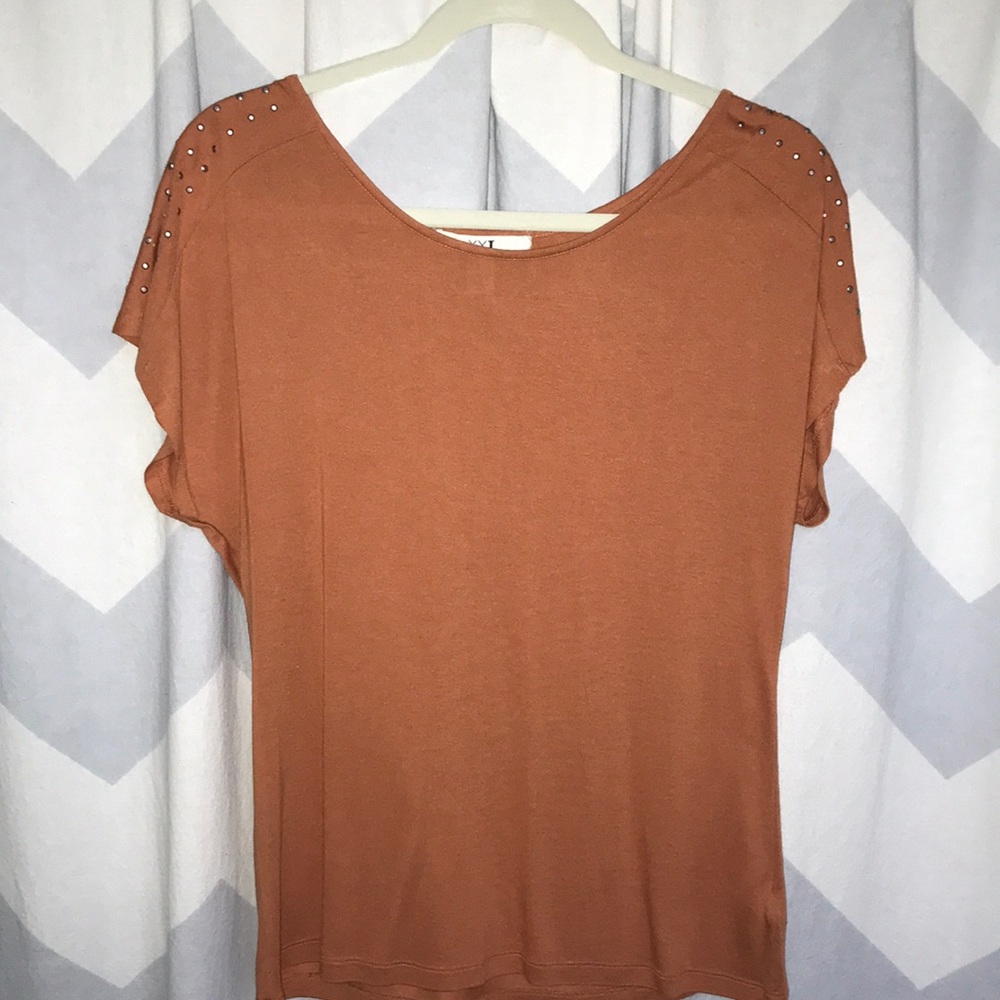 burnt orange top with studs on sleeves